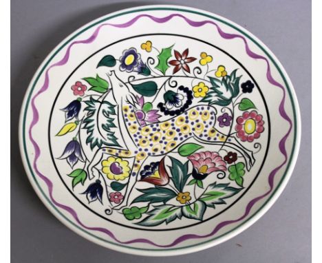 A POOLE POTTERY CIRCULAR DISH by N. BLACKMORE, colourful deer. Signed on reverse.  10.25ins diameter.