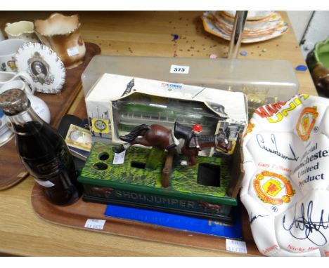 A reproduction show jumper money box, Manchester United merchandise football, a Royal State coach model ETC Condition reports