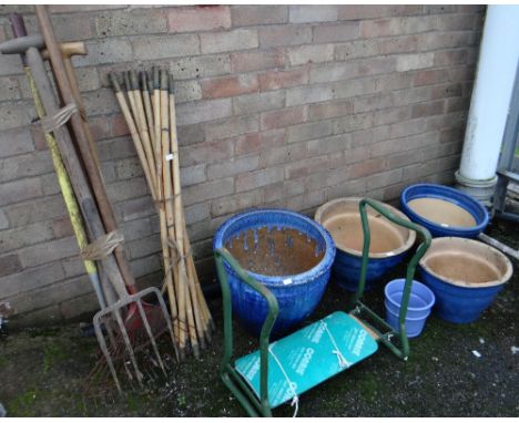 Four terracotta pots together with a selection of garden tools (outside) Condition reports provided on request by email  for 