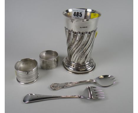 A fluted silver footed cylindrical vase with flared neck, hallmarked for Chester 1894, 5.3oz. together with two silver napkin