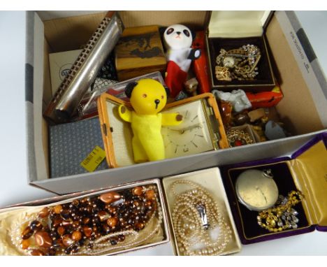 A box of mixed collectables including Sooty toys, cased vintage German harmonica ETC Condition reports provided on request by