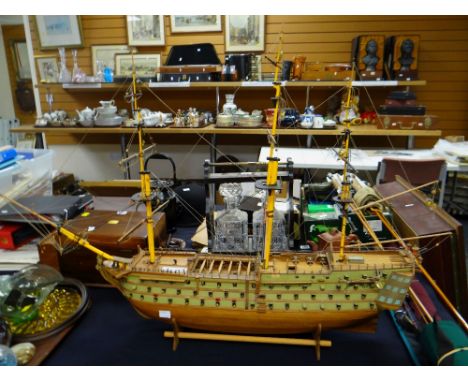 A rigged model of an HMS Victory battleship together with model-making tools &amp; parts (behind counter)Condition reports pr