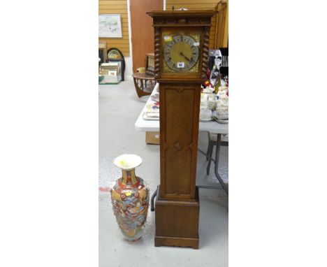 A vintage oak encased grandmother clock with brass dial &amp; silver chapter ring together with a Satsuma-type vase Condition