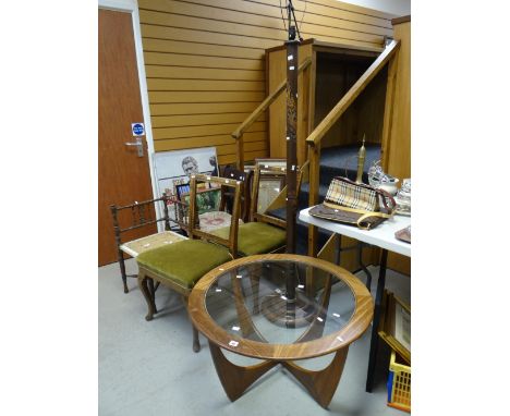 A G-Plan circular-top glass insert coffee table, four chairs for restoration &amp; a carved bamboo effect standard lamp Condi