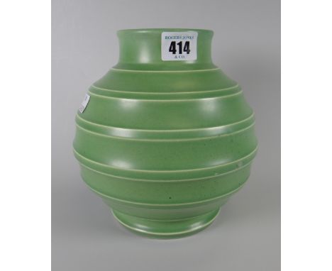 A Wedgwood Keith Murray design pottery vase of ribbed form in green glaze, 19cms high Condition reports provided on request b