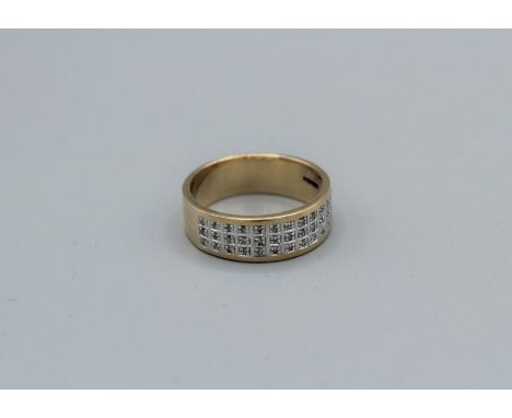 A 9ct gold and diamond three row ring, approximate total diamond weight 0.2ct), groos weight approximately 5gm