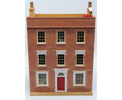 A large Dolls house in the form of a mid 18th century townhouse having eight sash windows and partcoed door, together with a 