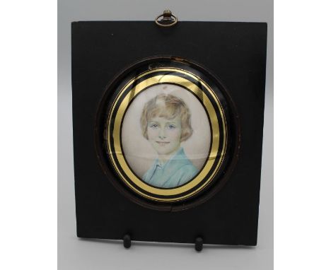 Attributed to Dora Webb (1886-1973)Bust length portrait miniature of a young girl, with short fair hair and pale blue jacket.