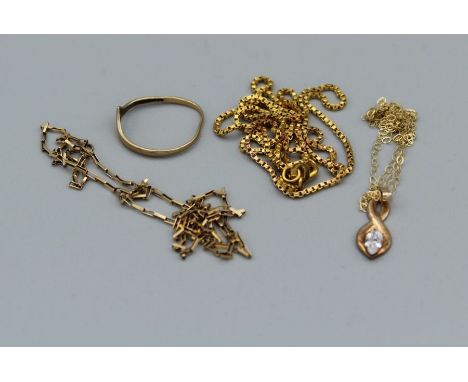 A selection of 9ct gold and yellow metal jewellery comprising a hallmarked complete box chain , a cubic zirconia pendant and 