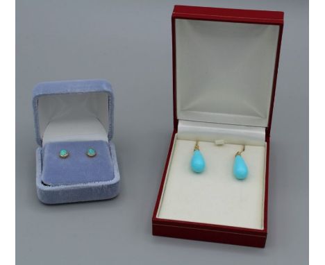 A pair of round opal cabochon ear studs set in yellow metal marked 14k and a&nbsp;pair of shepherd’s crook earrings with turq