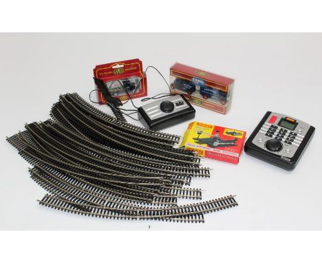 A quantity of track and controllers along with various accessories, vehicles and tools&nbsp;( 00 Gauge)