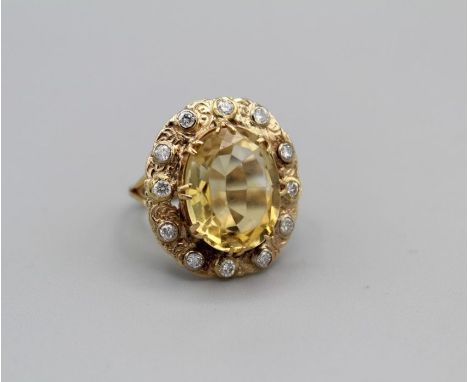 A Victorian citrine and diamond cocktail ring in ornate setting, gross weight approximately 7 gms, size O with sizer attachme