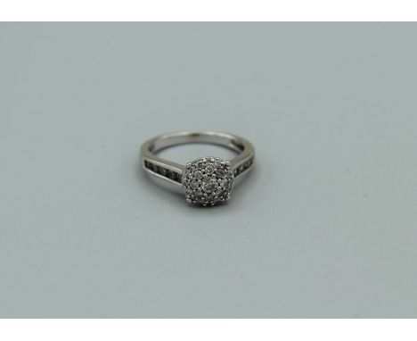 An 18ct white gold diamond cluster ring with total diamond weight of approx 0.45ct, 3.8gm approx