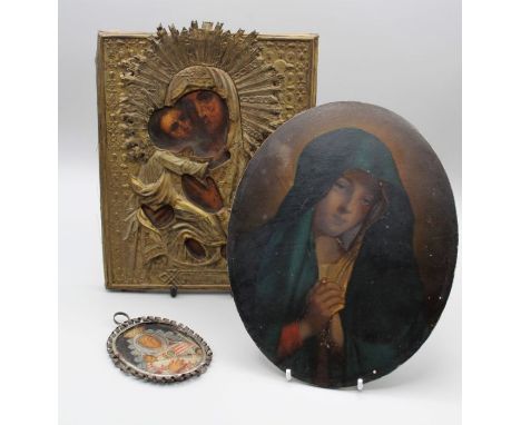 A 19th century Russian icon, written with The Holy Mother and Christ beneath a worked brass mount, 24 x 18cm, together with a