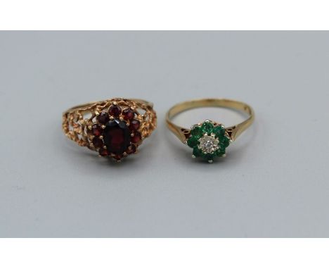 A 9ct gold emerald and diamond dress ring, approximate gross weight 2.4gm, plus a yellow metal and garnet cluster ring, stamp