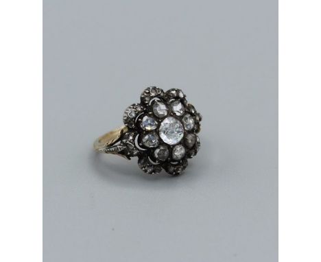 A Georgian diamond set cluster ring, set with thirty rose cut diamonds, with the principal stone measuring approximately 5mm 