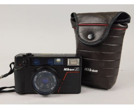 A Nikon L35 AF camera, with Sharp Nikon 35mm lens and carrying case