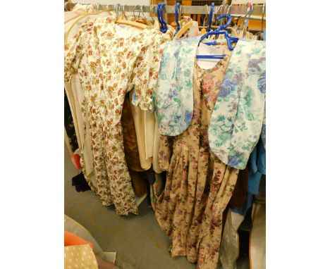 Various ladies' vintage clothing, to include a faux fur coat, brown high necked dress, Laura Ashley floral day dress, etc. (o