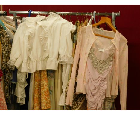 A quantity of ladies' vintage clothing, to include Broderie Anglaise top, pleated mid length skirts, floral blouses etc. (one