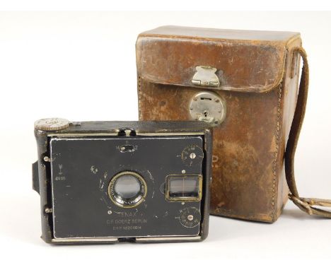 A C P Goerz Tenax strut folding plate camera, early 20thC, in leather carrying case with strap, case (AF).