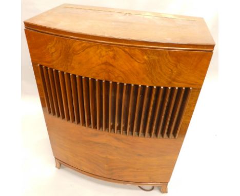 A Decca radiogram, in bow fronted walnut case, comprising record player and radio, above a large grille speaker, on splayed l