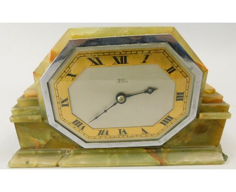 An Art Deco mantel clock, in onyx case, the silvered dial with brass chapter ring stamped Usher Lincoln, (AF), 23.5cm wide