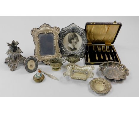 A collection of silver plate etc., to include a rococo style candlestick, photograph frames etc.