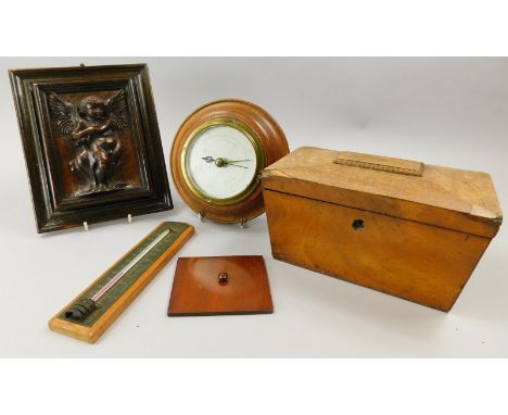 A collection of wooden objects, to include a continental walnut plaque, carved in the form of a putto with stylised shield, 1