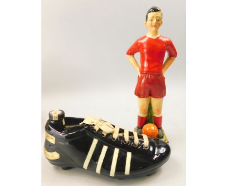 A vintage figure of a footballer, titled 'Up the Reds', possibly Liverpool football club and a K.L.E.M football boot decanter