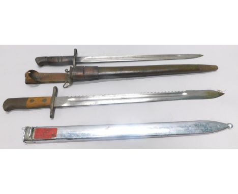 Two bayonets, one with a wooden handle and serrated edge, the other a US issue bayonet from the 1st World War with leather sc