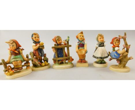 Six Goebel Hummel figures of girls, to include one with a chick, one with a blue tit etc.
