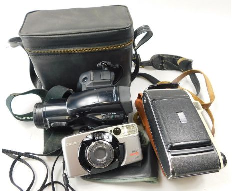 An Olympus IS-100 camera, in fitted case, a Kodak bellows camera and a Canon Prima Super 105 camera (3)