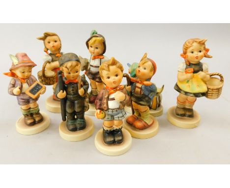 A collection of eight Goebel Hummel figures, to include two girls modelled with a basket, a child with a writing slate, a chi