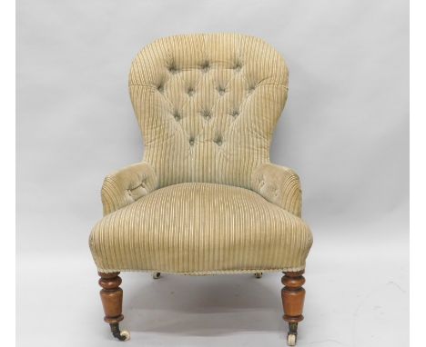 A Victorian mahogany nursing chair, on turned legs with ceramic castors, loose covers