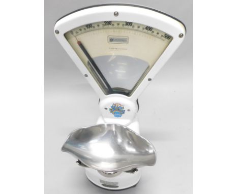 A set of white enamel shop scales, labelled for Lincoln Shop Equipment Ltd etc.