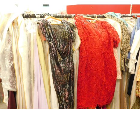 A quantity of ladies' vintage clothing, to include a velvet floral embroidered bolero jacket, day dresses, emerald green lace