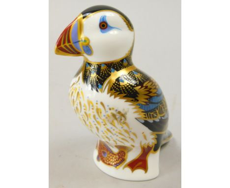 A Royal Crown Derby porcelain puffin paperweight, gold button