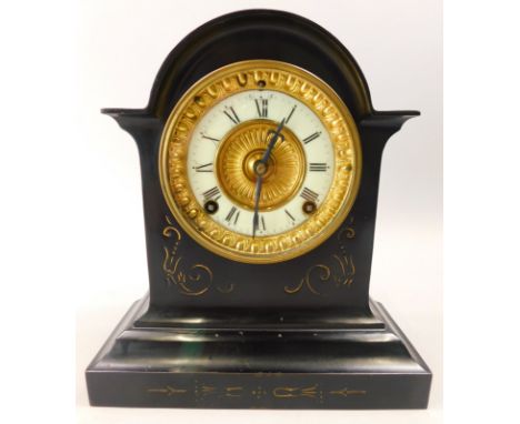 A late 19thC French black slate and parcel gilt mantel clock, the enamel dial with Roman numerals within a gilt slip