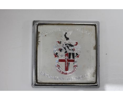 A vintage Institute of Medical Laboratory Technology car badge