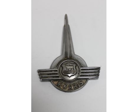 A large vintage Morris van badge