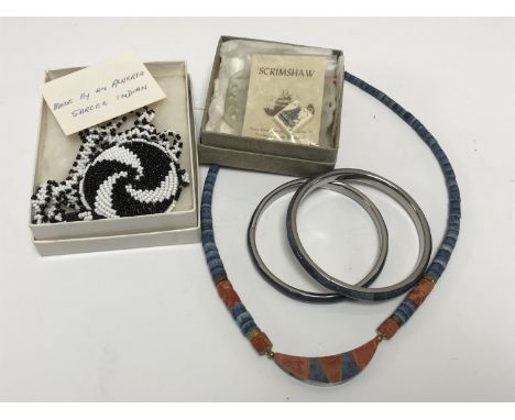 A costume necklace and two matching bangles, a Canadian beadwork necklace, a scrimshaw pendant and a Chinese cared jade plaqu