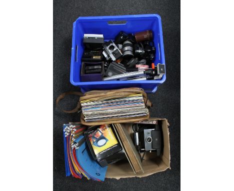 Three boxes containing cameras, tripod and accessories, vinyl records etc CONDITION REPORT: To include; Two Canon EOS 1000F c