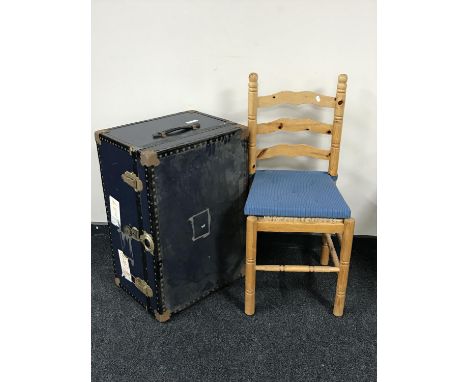 A metal bound trunk and a pine ladder back dining chair 