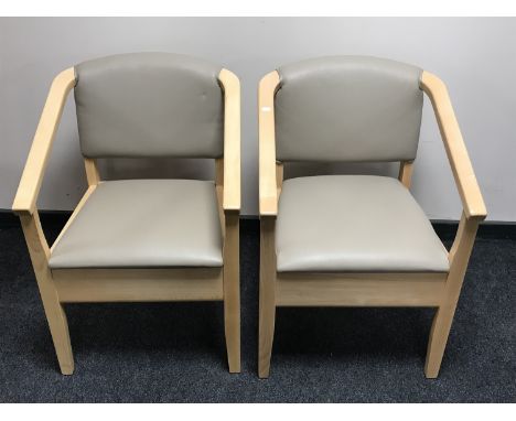 A pair of contemporary beech framed commode armchairs 