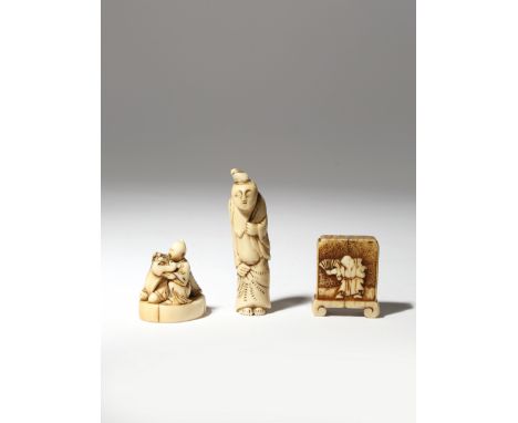 Two in ivory, one carved as a man and a recumbent ox, the other a tsuitate screen with a figure holding a fan to one side and