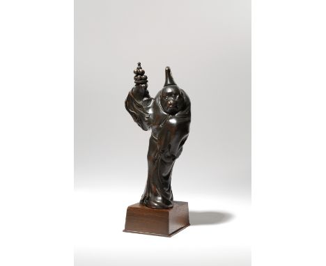 A JAPANESE WOOD CARVING OF A MONKEY, OKIMONO MEIJI PERIOD, 19TH CENTURY The primate with inlaid eyes and depicted standing we