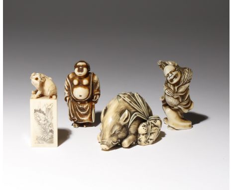 λ THREE JAPANESE IVORY NETSUKE MEIJI PERIOD, 19TH AND 20TH CENTURY One carved as a large boar sleeping on a bed of autumnal l