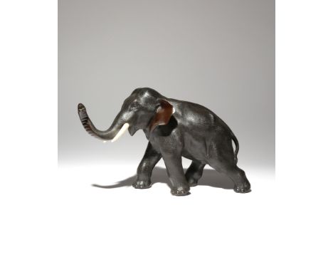 λ A JAPANESE BRONZE MODEL OF AN ELEPHANT, OKIMONO MEIJI PERIOD, 19TH CENTURY The pachyderm standing four-square and with its 