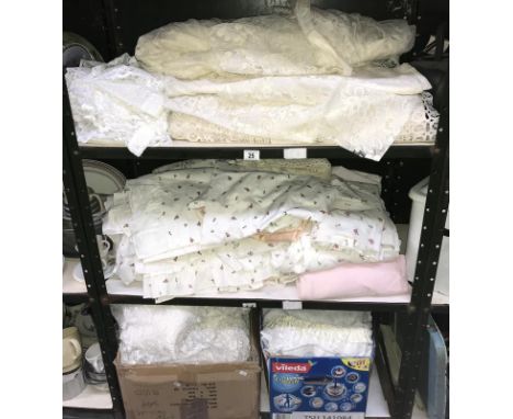 3 shelves of bedding & net curtains