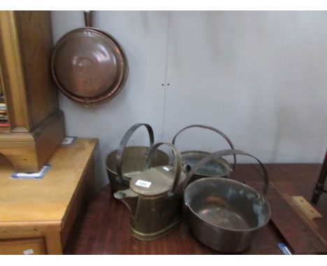 3 brass jam pans, a brass watering can and a copper warming pan and a hay fork